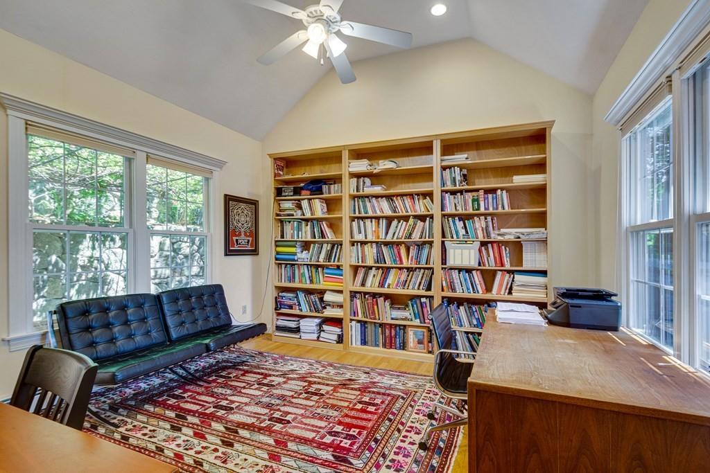 65 Wachusett Road Needham, MA 02492 - Photo 23 of 42 a living room with a large couches and a book shelf