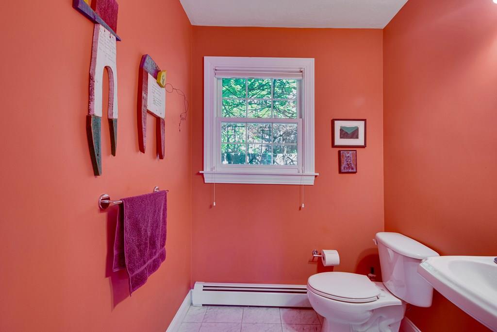 65 Wachusett Road Needham, MA 02492 - Photo 25 of 42 a white toilet sitting next to a blue wall