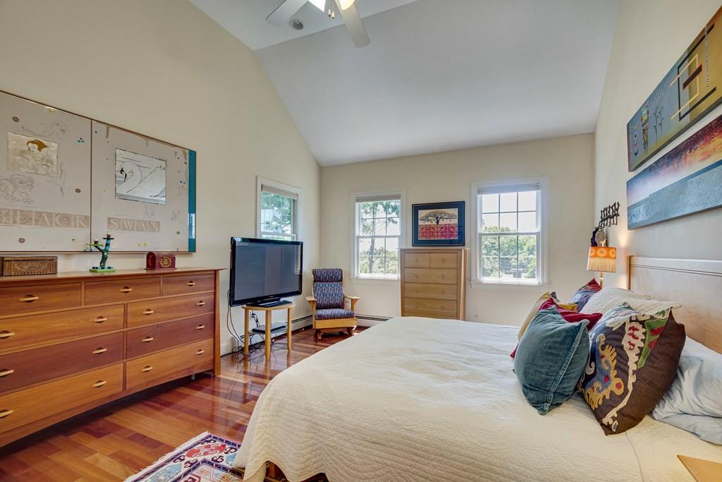 65 Wachusett Road Needham, MA 02492 - Photo 26 of 42 a bedroom with a bed and a flat tv screen on dresser