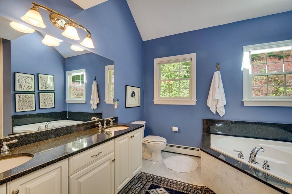 65 Wachusett Road Needham, MA 02492 - Photo 28 of 42 a bathroom with a sink and a mirror