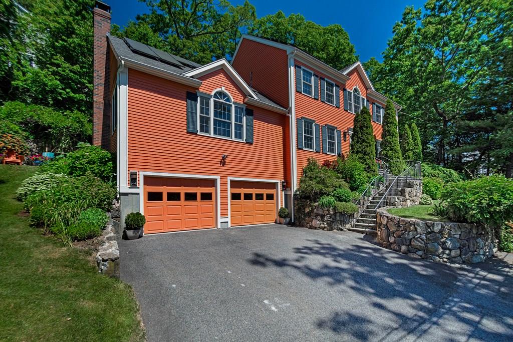 65 Wachusett Road Needham, MA 02492 - Photo 3 of 42 a front view of a house with a yard and trees