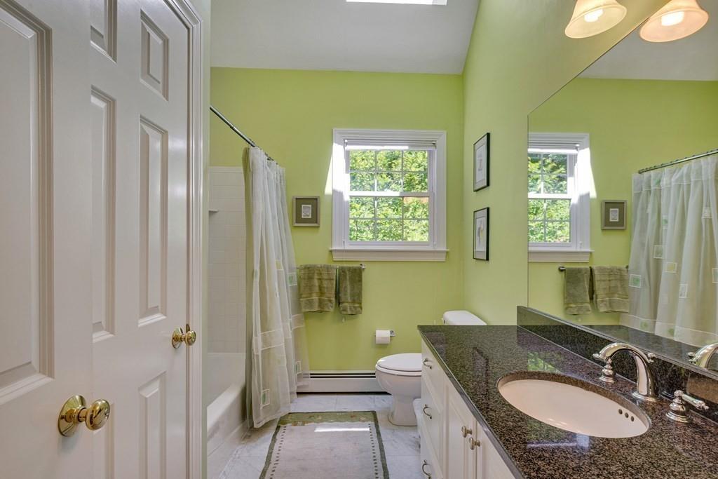 65 Wachusett Road Needham, MA 02492 - Photo 34 of 42 a bathroom with a granite countertop sink and a mirror