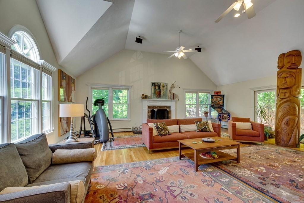 65 Wachusett Road Needham, MA 02492 - Photo 10 of 42 a living room with furniture fireplace and a large window