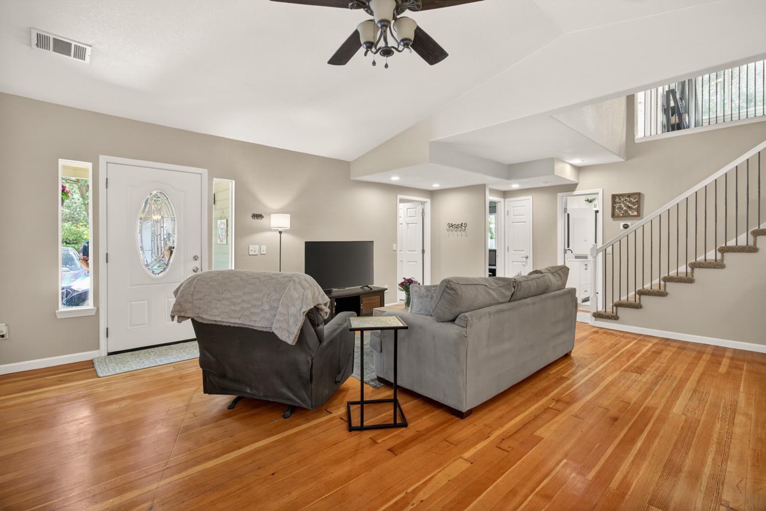 6332 Horseshoe Bar Road Loomis, CA 95650 - Photo 13 of 85 Living area featuring wood-finish flooring, a vaulted ceiling, and a ceiling fan