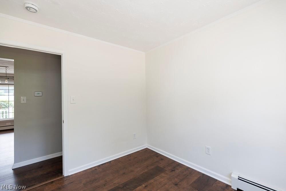 32618 Detroit Road Avon, OH 44011 - Photo 31 of 40 Dark wood-finish flooring with white baseboards and trim