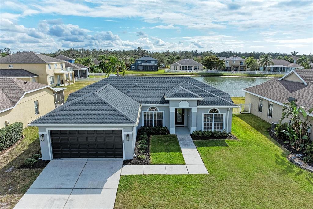 11343 Walden Loop Parrish, FL 34219 - Photo 1 of 1 an aerial view of house with yard and entertaining space