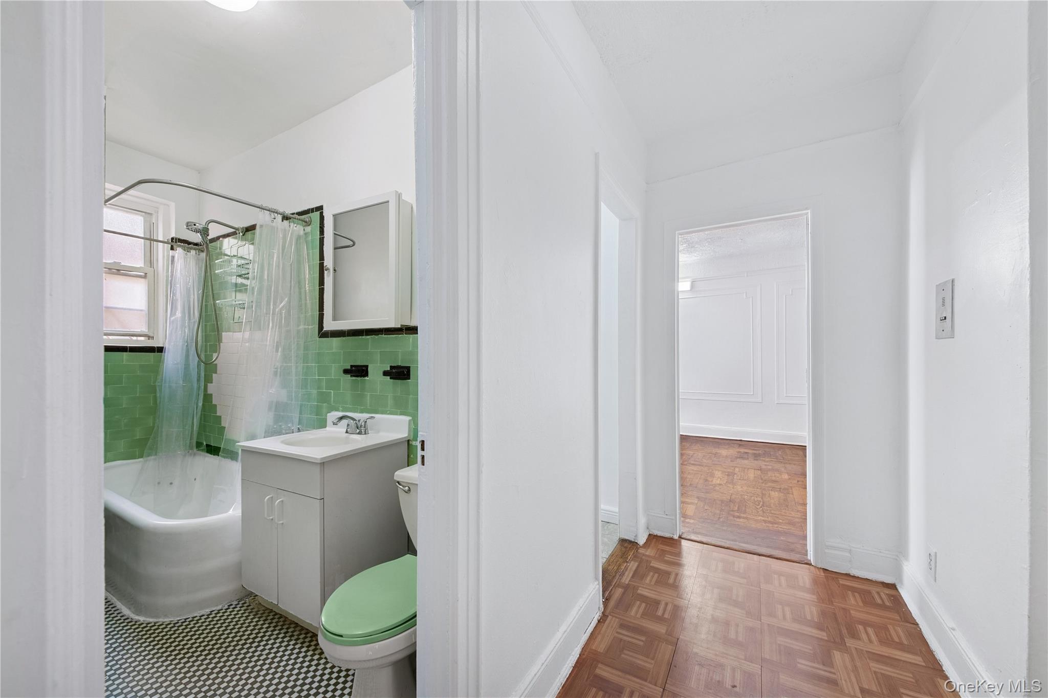 41-25 44th Street, Unit C5 Queens, NY 11104 - Photo 11 of 14 a bathroom with a toilet and a shower