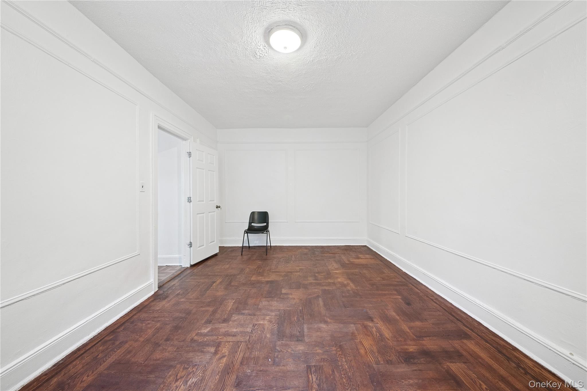 41-25 44th Street, Unit C5 Queens, NY 11104 - Photo 10 of 14 an empty room with an entryway