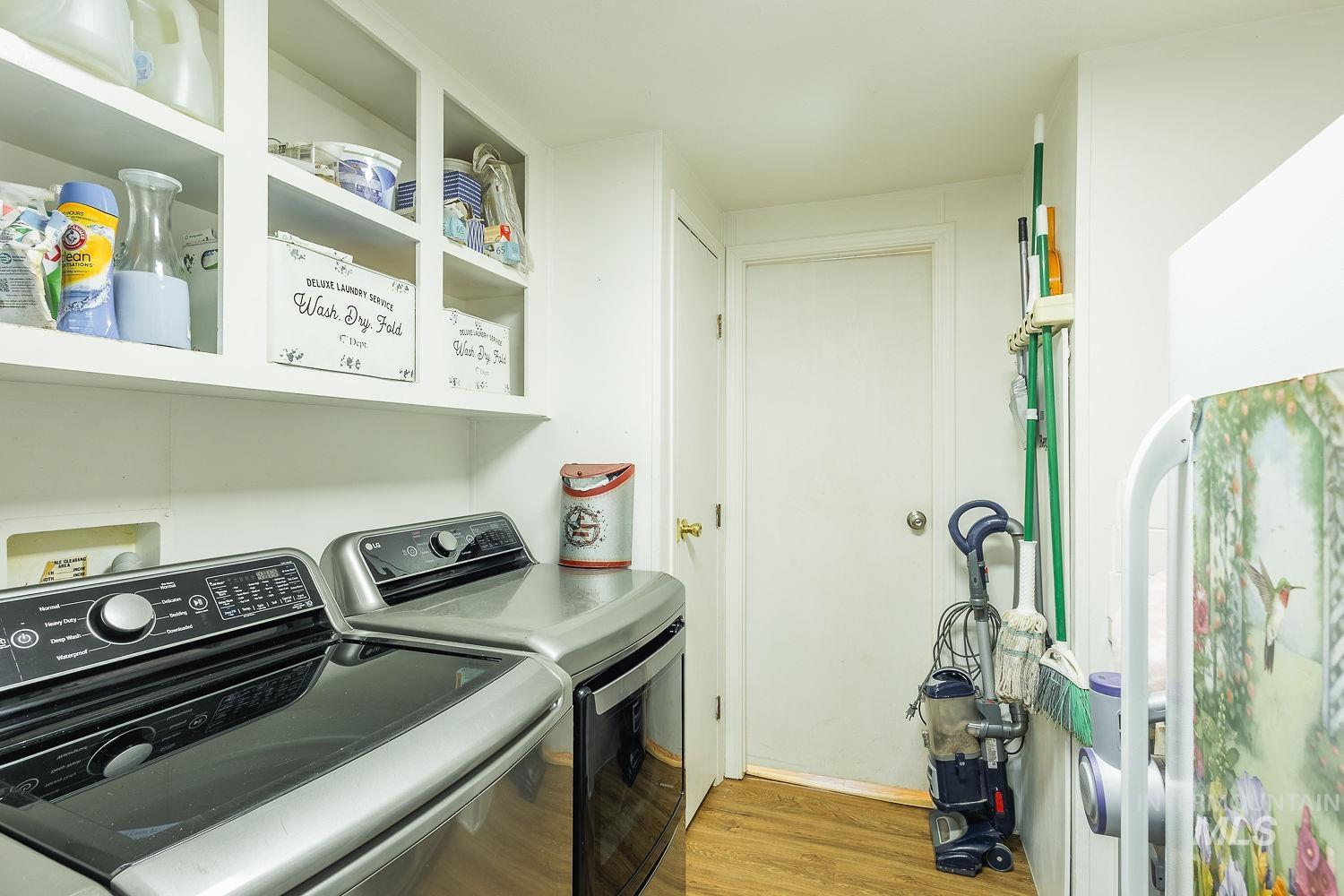 10 Reseda Ridge Circle Garden Valley, ID 83622 - Photo 28 of 28 Laundry area featuring light wood-style flooring and washer and dryer