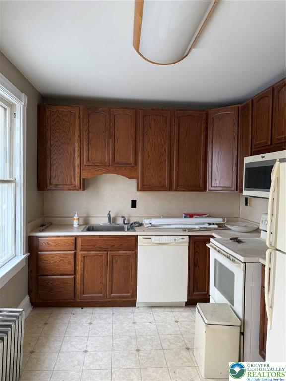 170 North Whitfield Street, Unit 2 Nazareth, PA 18064 - Photo 6 of 12 a kitchen with cabinets a sink and white appliances