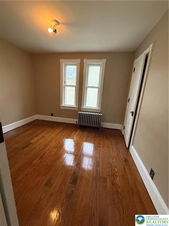 170 North Whitfield Street, Unit 2 Nazareth, PA 18064 - Photo 7 of 12 an empty room with wooden floor and windows