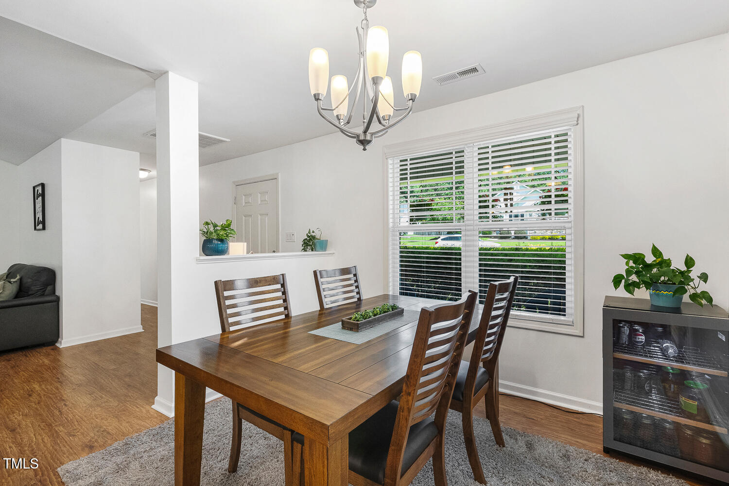 131 Abacos Court Clayton, NC 27520 - Photo 12 of 39 a view of a dining room with furniture wooden floor and chandelier