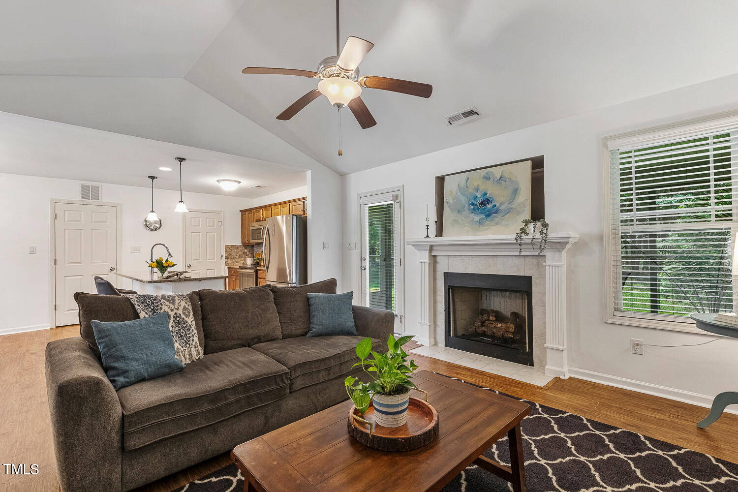 131 Abacos Court Clayton, NC 27520 - Photo 14 of 39 a living room with furniture and a fireplace