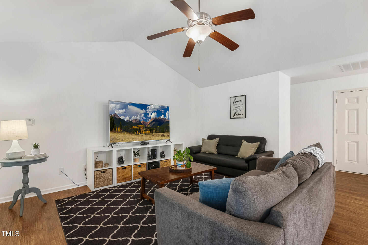 131 Abacos Court Clayton, NC 27520 - Photo 16 of 39 a living room with furniture and a flat screen tv