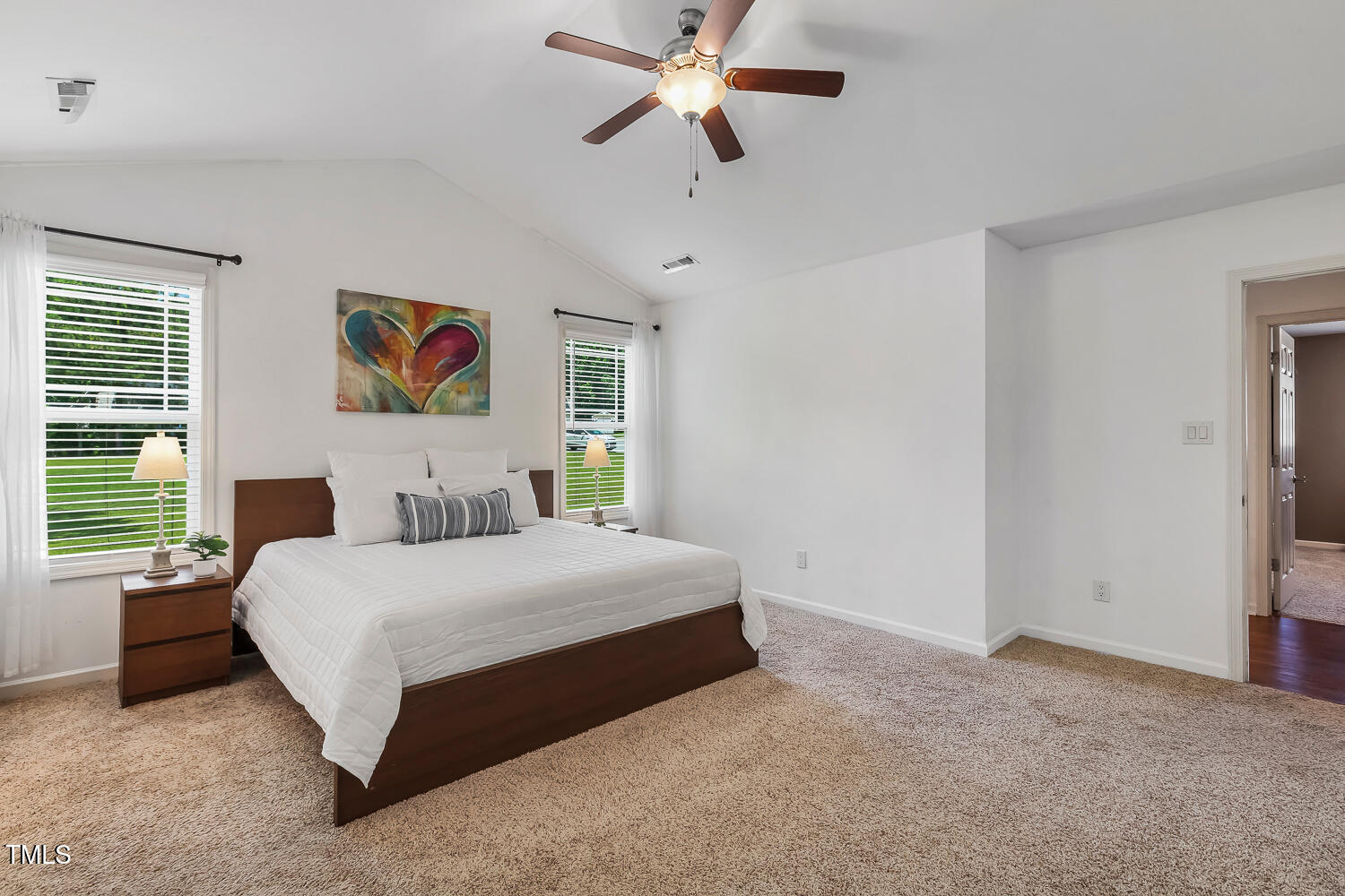 131 Abacos Court Clayton, NC 27520 - Photo 19 of 39 a bedroom with a bed dresser and window