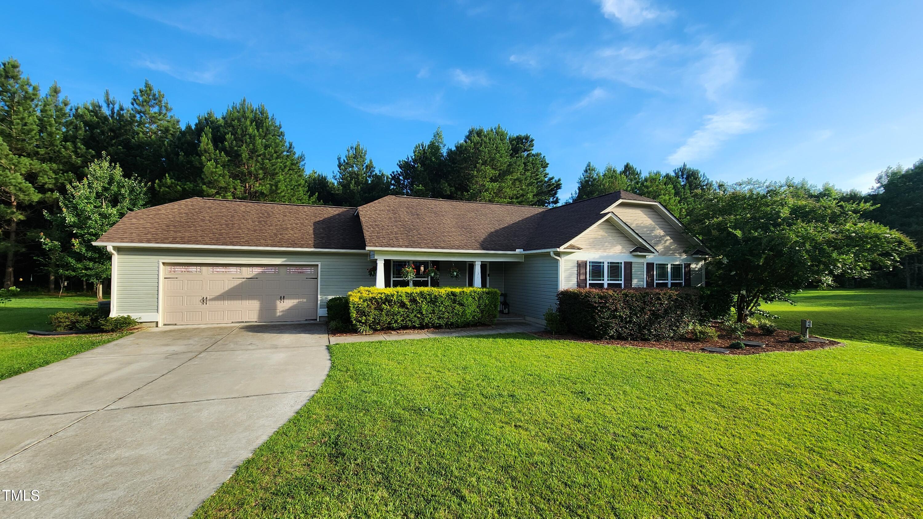 131 Abacos Court Clayton, NC 27520 - Photo 2 of 39 a front view of a house with yard and green space