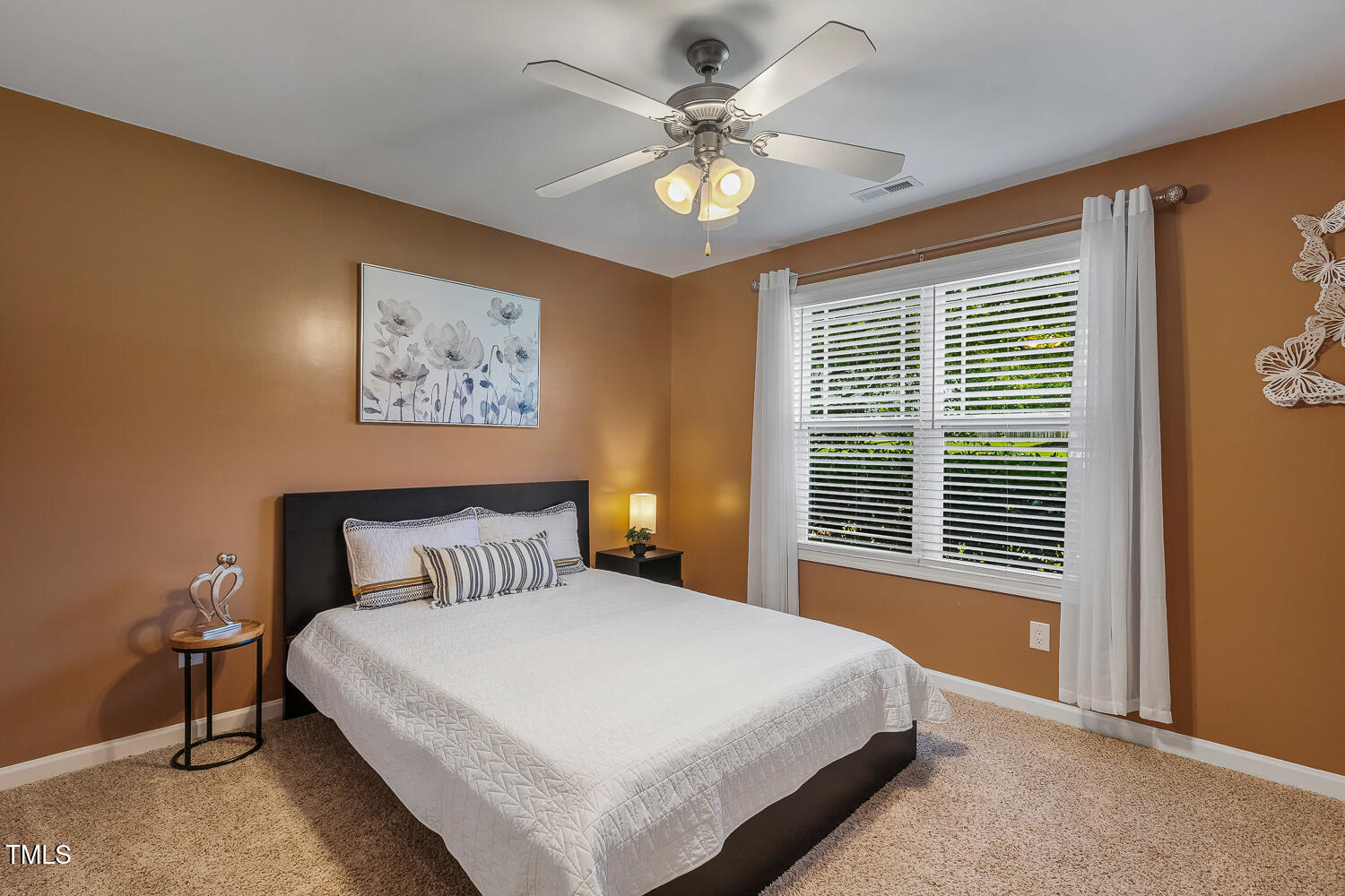 131 Abacos Court Clayton, NC 27520 - Photo 23 of 39 a bedroom with a large bed and a window