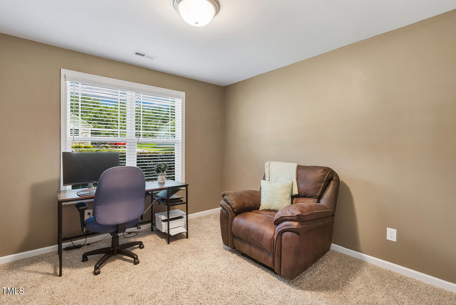 131 Abacos Court Clayton, NC 27520 - Photo 26 of 39 a living room with furniture and a window