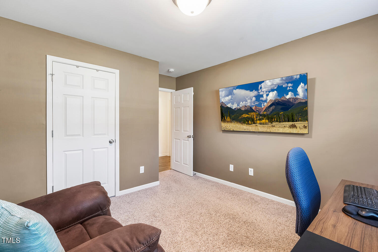131 Abacos Court Clayton, NC 27520 - Photo 27 of 39 a bedroom with furniture and wooden floor