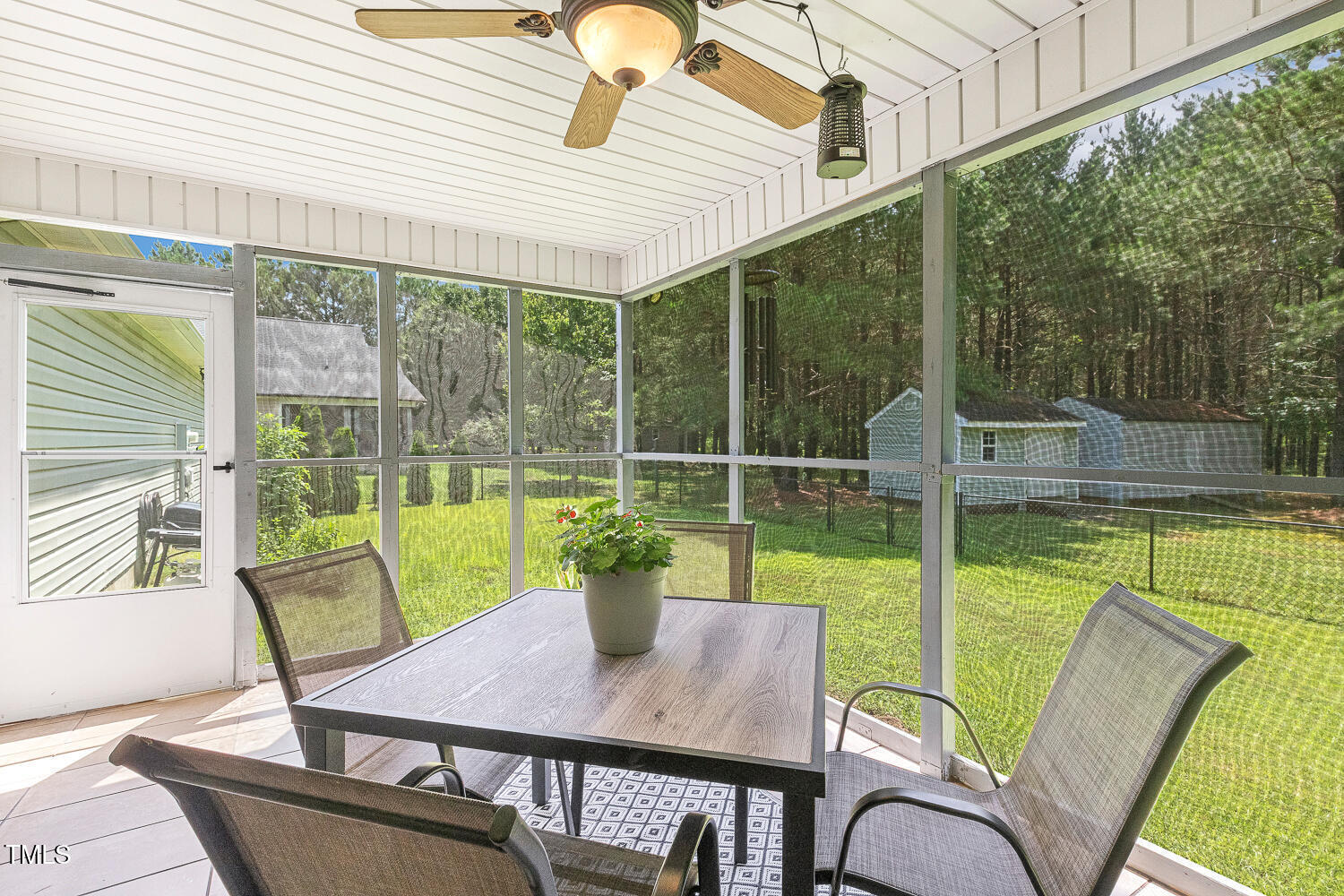 131 Abacos Court Clayton, NC 27520 - Photo 32 of 39 a view of deck with a table and chairs