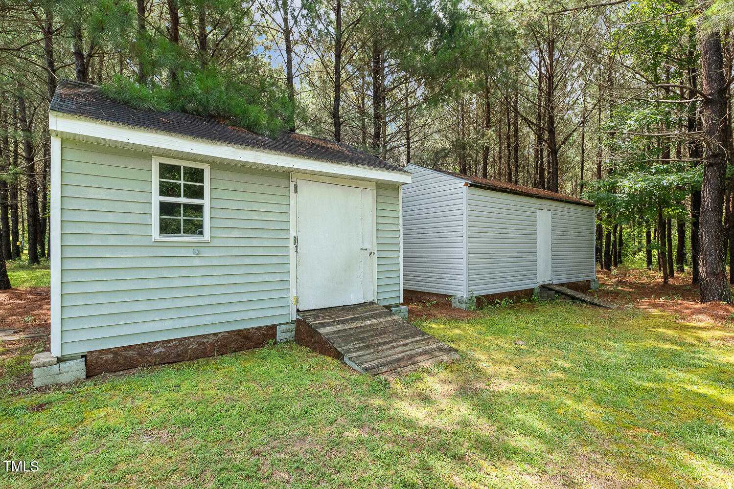 131 Abacos Court Clayton, NC 27520 - Photo 36 of 39 a view of a backyard with a large tree