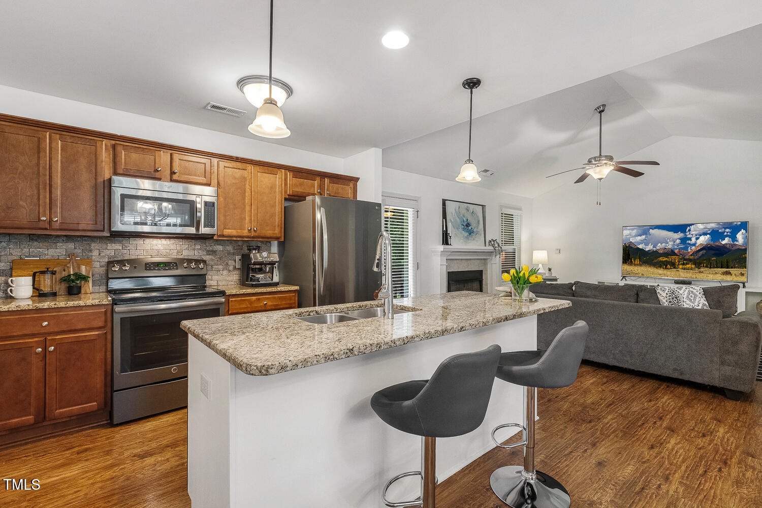 131 Abacos Court Clayton, NC 27520 - Photo 7 of 39 a kitchen with sink refrigerator and microwave