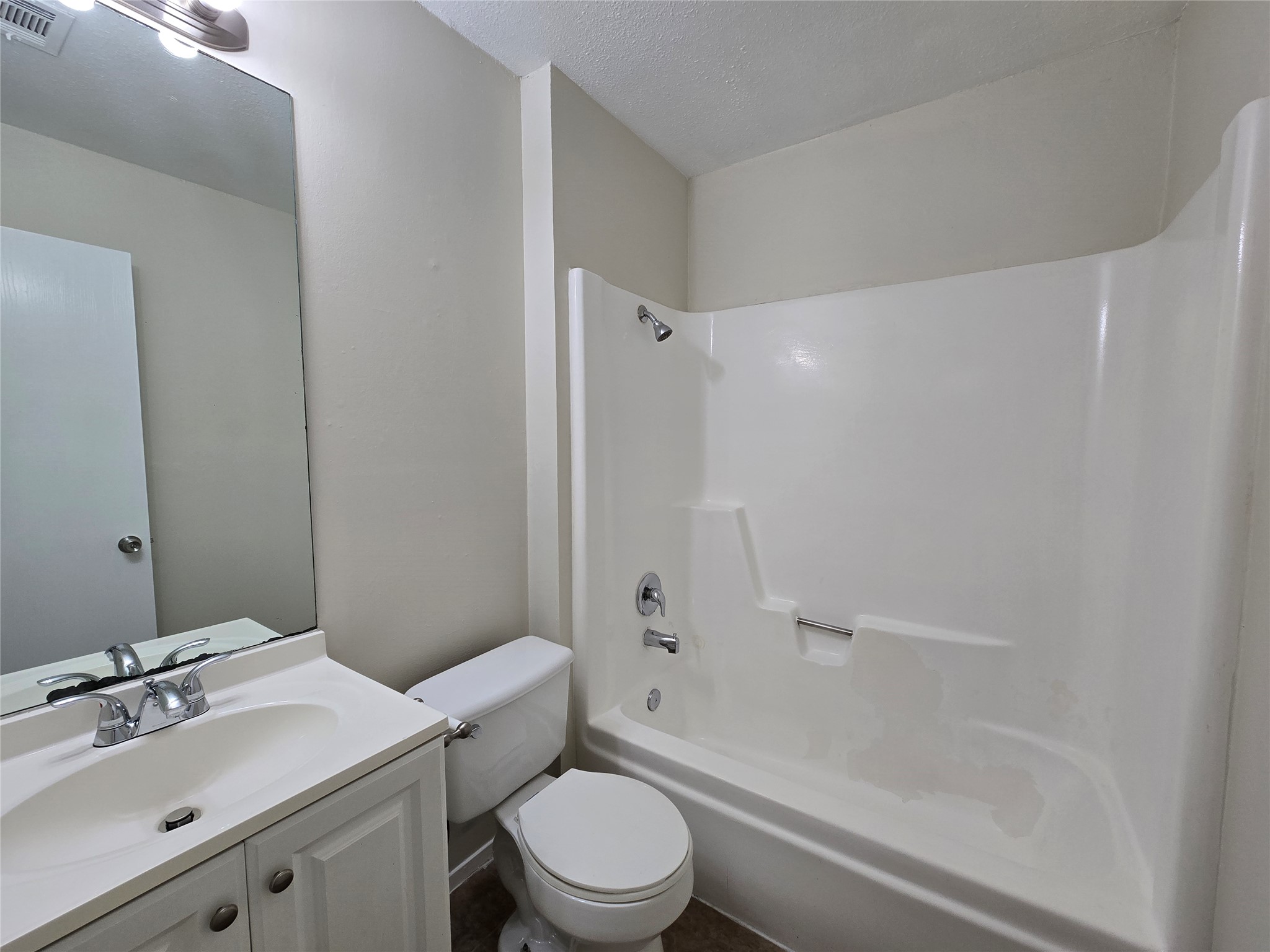 6206 Buffalo Pass, Unit A Austin, TX 78745 - Photo 16 of 24 Bright and clean full bath featuring a vanity with ample storage and an integrated shower-tub.