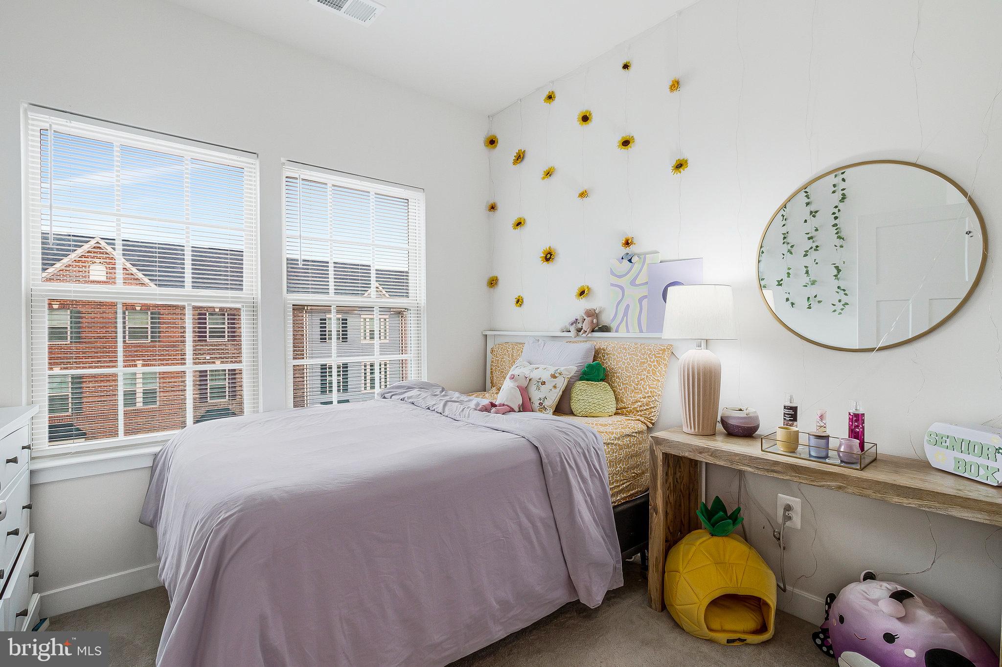 16504 Caribbean Way Accokeek, MD 20607 - Photo 15 of 29 a bedroom with a bed and a window