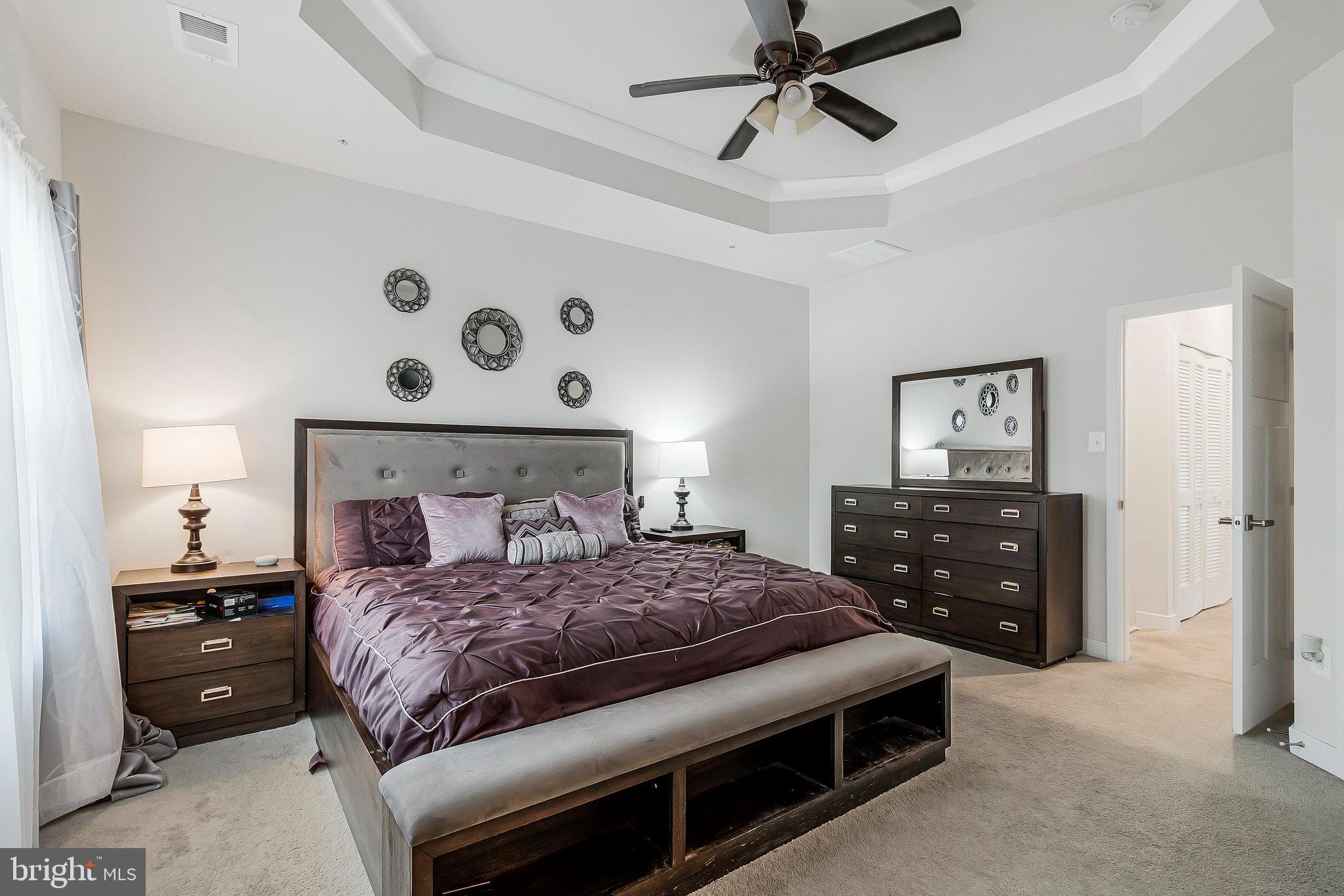 16504 Caribbean Way Accokeek, MD 20607 - Photo 21 of 29 a bedroom with a bed and a dresser