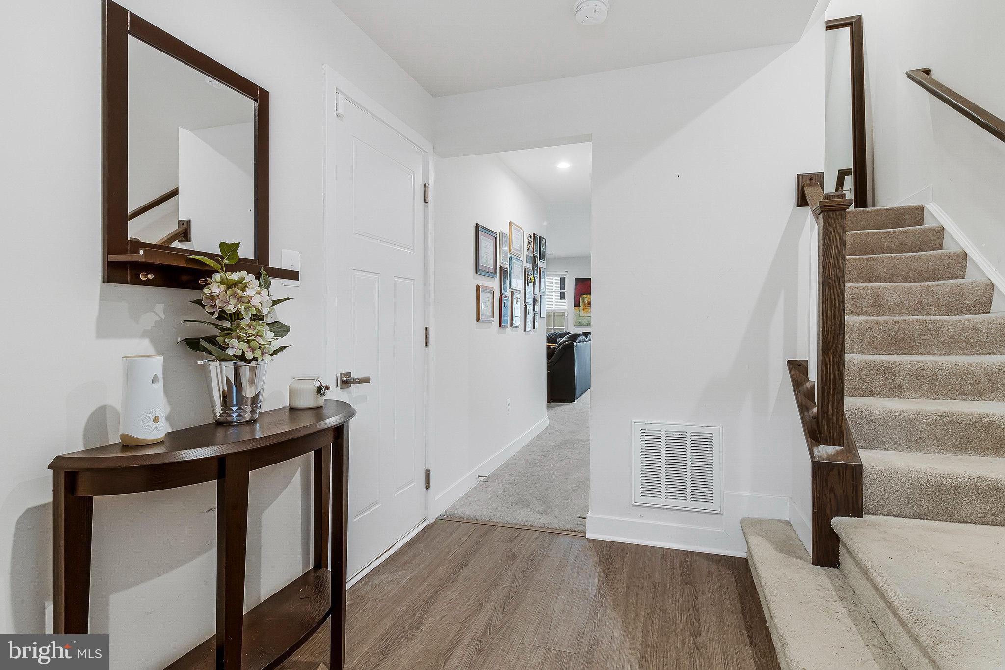 16504 Caribbean Way Accokeek, MD 20607 - Photo 3 of 29 a view of entryway and hall with wooden floor
