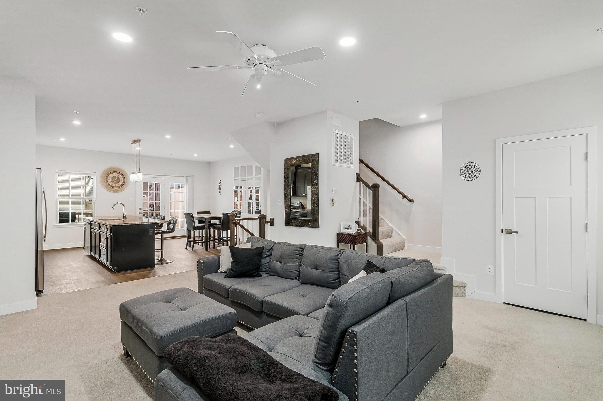 16504 Caribbean Way Accokeek, MD 20607 - Photo 6 of 29 a living room with furniture and a ceiling fan