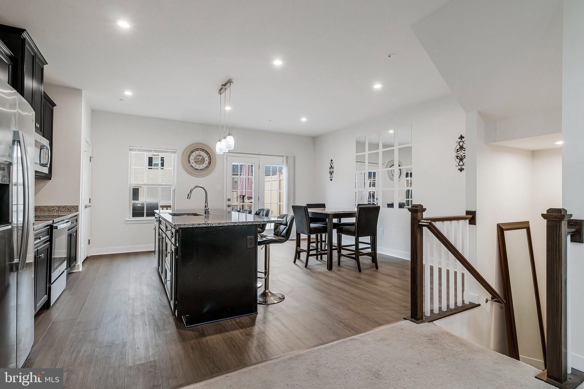 16504 Caribbean Way Accokeek, MD 20607 - Photo 8 of 29 a living room with furniture a wooden floor and a flat screen tv