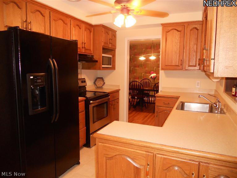 1945 Temblethurst Road South Euclid, OH 44121 - Photo 6 of 15 Updated Kitchen with New Stainless Steel Appliances in 2012, Loads of Cabinets, Pantry, Dinette Area with Sliding Glass Doors to Patio