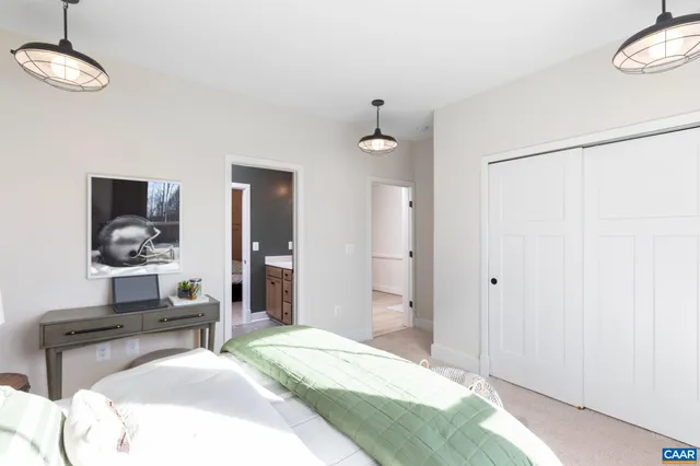 a bedroom with a bed and a table in it