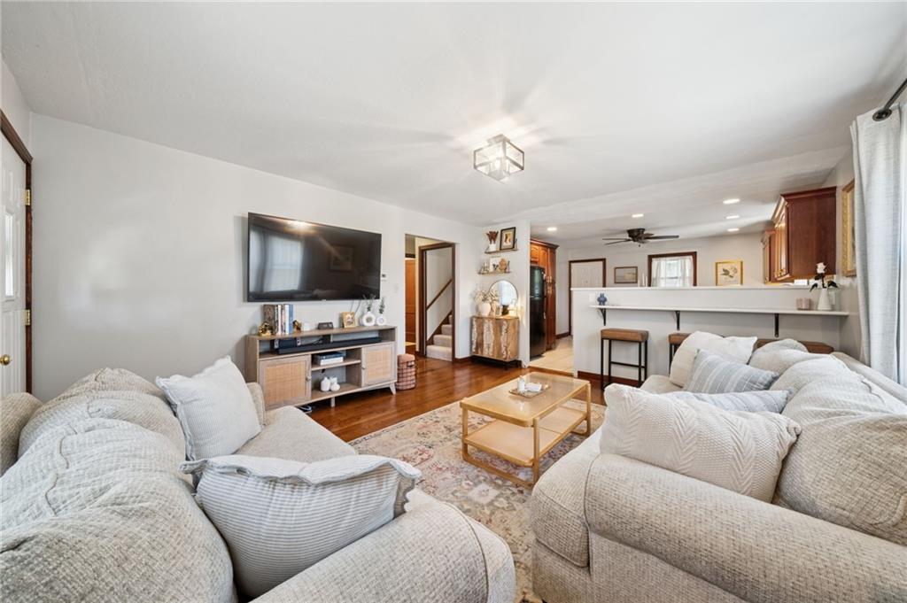 135 Pear Orchard Road Coraopolis, PA 15108 - Photo 11 of 43 a living room with furniture and a flat screen tv