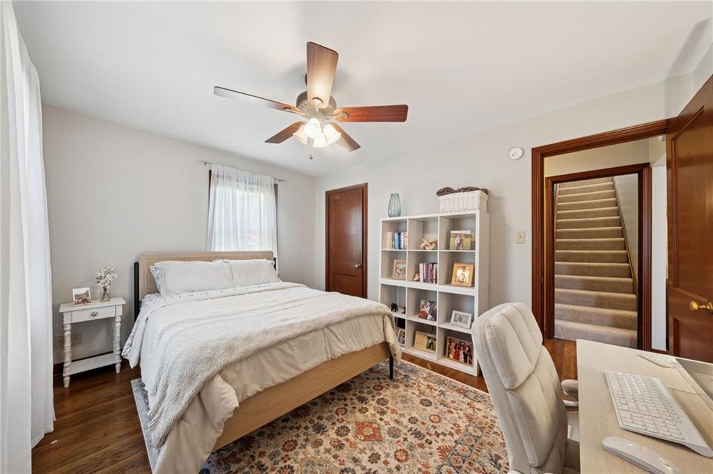 135 Pear Orchard Road Coraopolis, PA 15108 - Photo 17 of 43 a bedroom with a bed a bookshelf and a chandelier