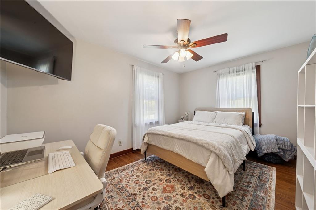 135 Pear Orchard Road Coraopolis, PA 15108 - Photo 18 of 43 a bedroom with a bed and a chandelier