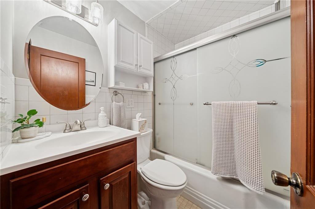 135 Pear Orchard Road Coraopolis, PA 15108 - Photo 22 of 43 a bathroom with a sink a toilet and shower a mirror