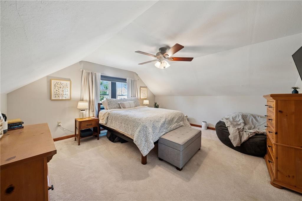 135 Pear Orchard Road Coraopolis, PA 15108 - Photo 23 of 43 a bedroom with a bed and a chandelier