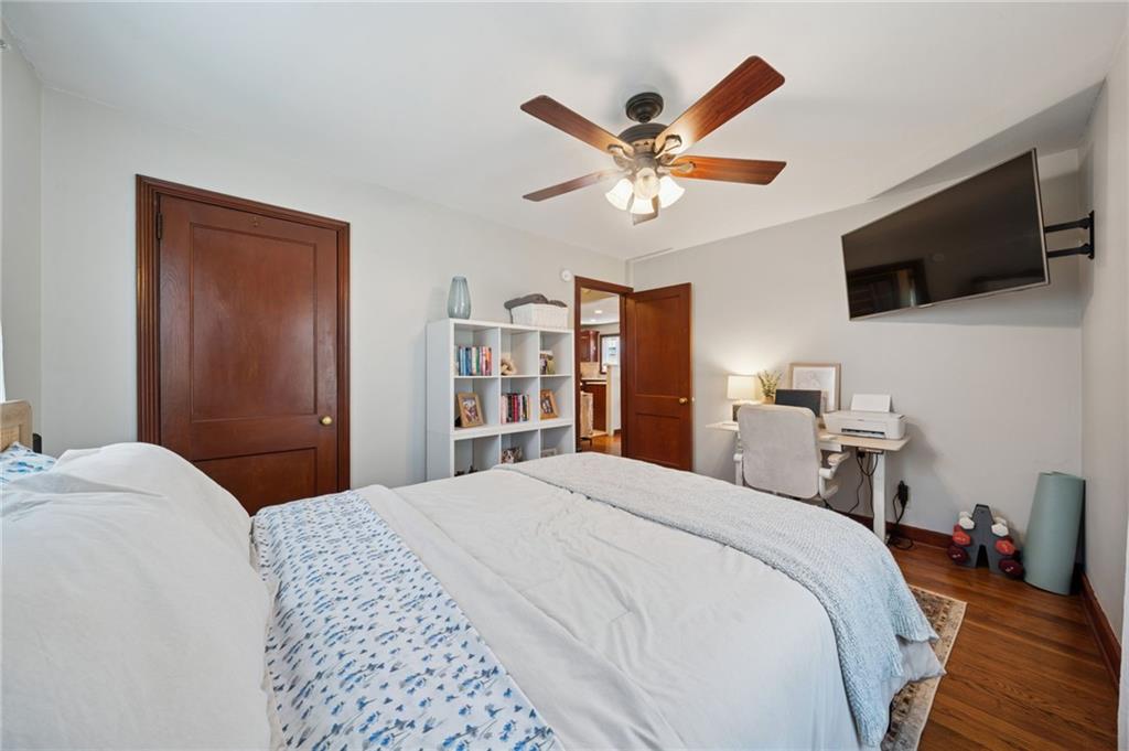 135 Pear Orchard Road Coraopolis, PA 15108 - Photo 24 of 43 a bedroom with a large bed and a flat tv screen