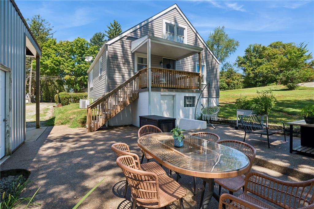 135 Pear Orchard Road Coraopolis, PA 15108 - Photo 36 of 43 a patio with table and chairs and potted plants
