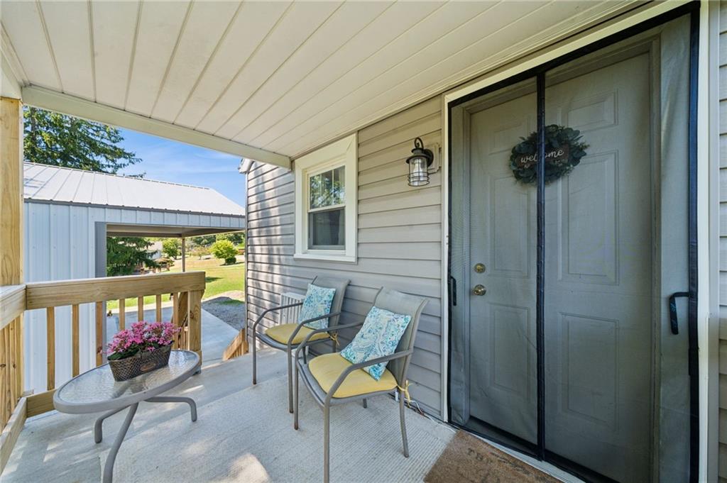 135 Pear Orchard Road Coraopolis, PA 15108 - Photo 42 of 43 a view of a porch with furniture and a yard