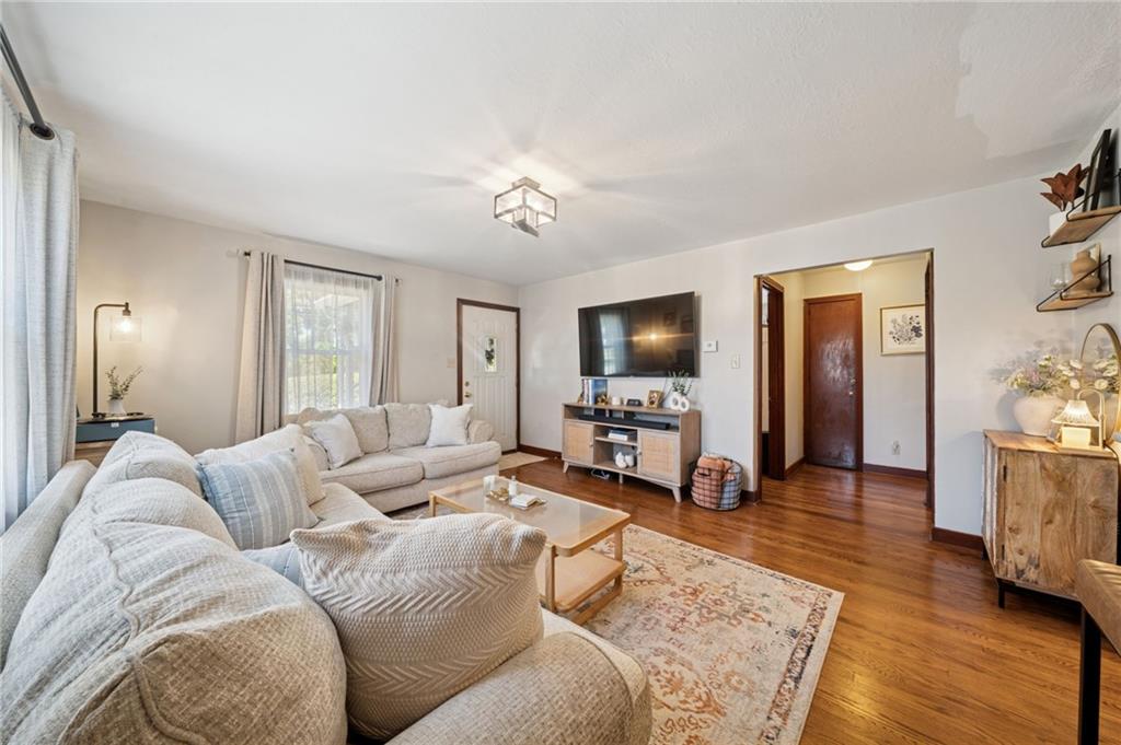 135 Pear Orchard Road Coraopolis, PA 15108 - Photo 9 of 43 a living room with furniture and a flat screen tv