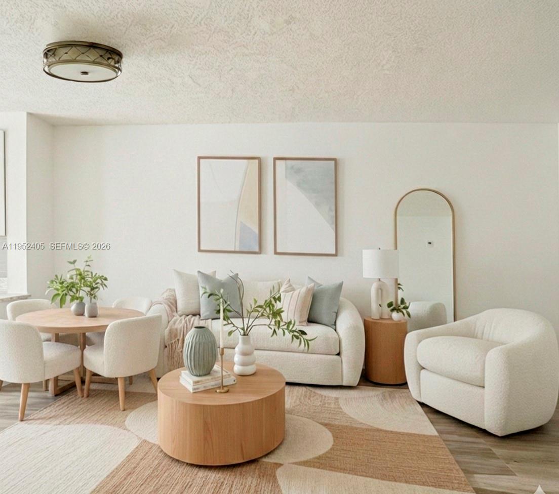 a living room with furniture and a potted plant