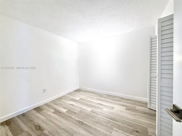 a view of a room that has a window