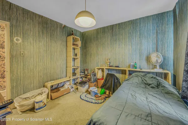 a view of a two room with furniture