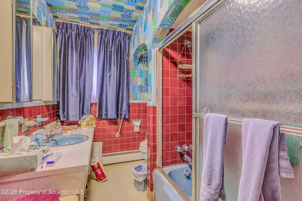 a bathroom with a sink and a tub