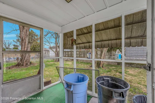 a room with furniture and a garden