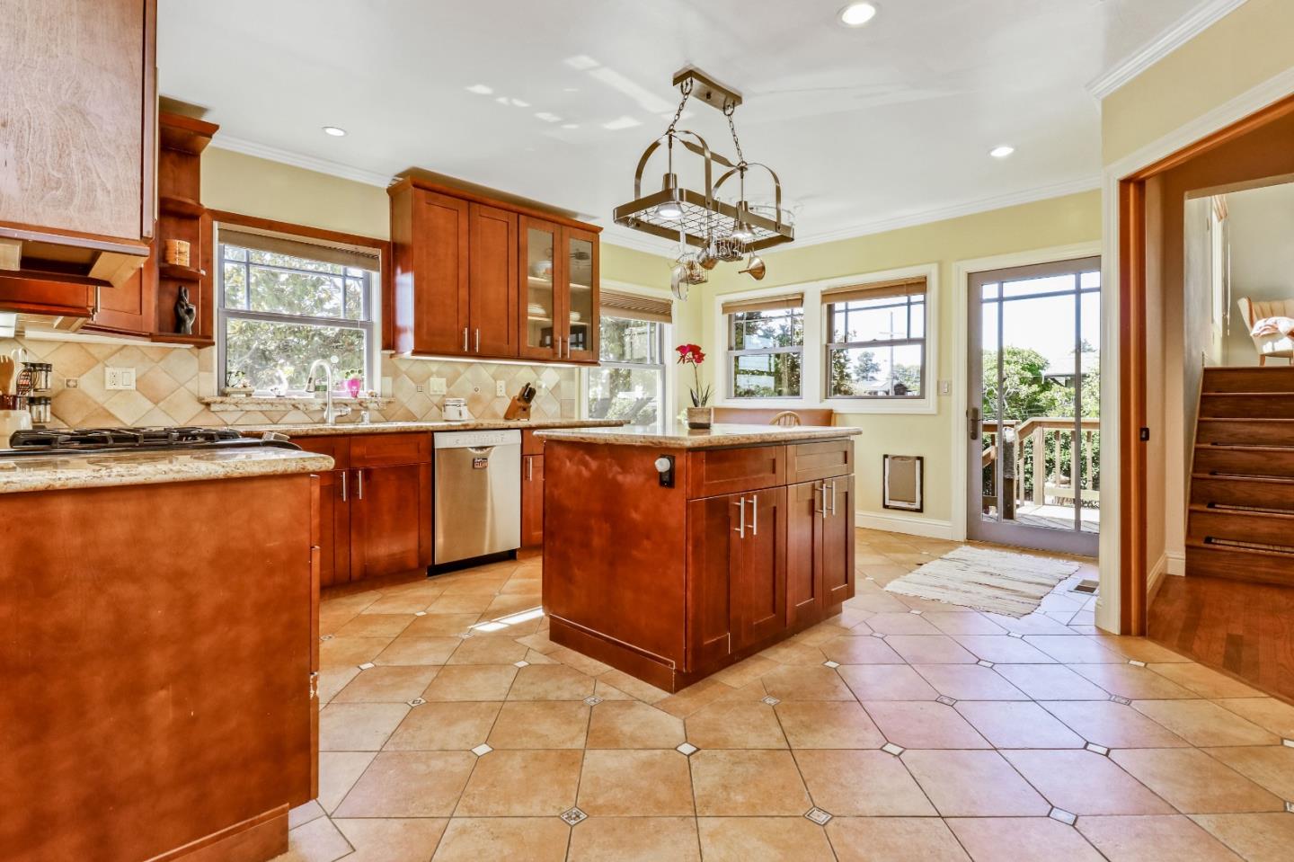 1401 Channing Way Berkeley, CA 94702 - Photo 14 of 43 a kitchen with stainless steel appliances granite countertop a sink and cabinets