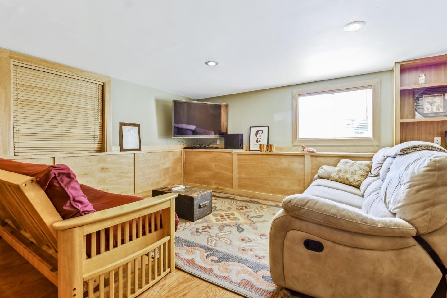 1401 Channing Way Berkeley, CA 94702 - Photo 26 of 43 a living room with furniture and a flat screen tv